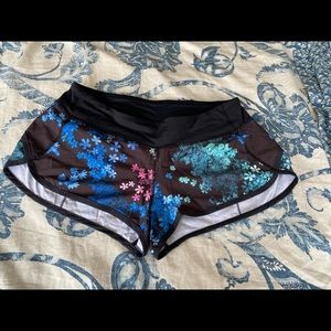 Black floral Lululemon Speed Shorts, size 8